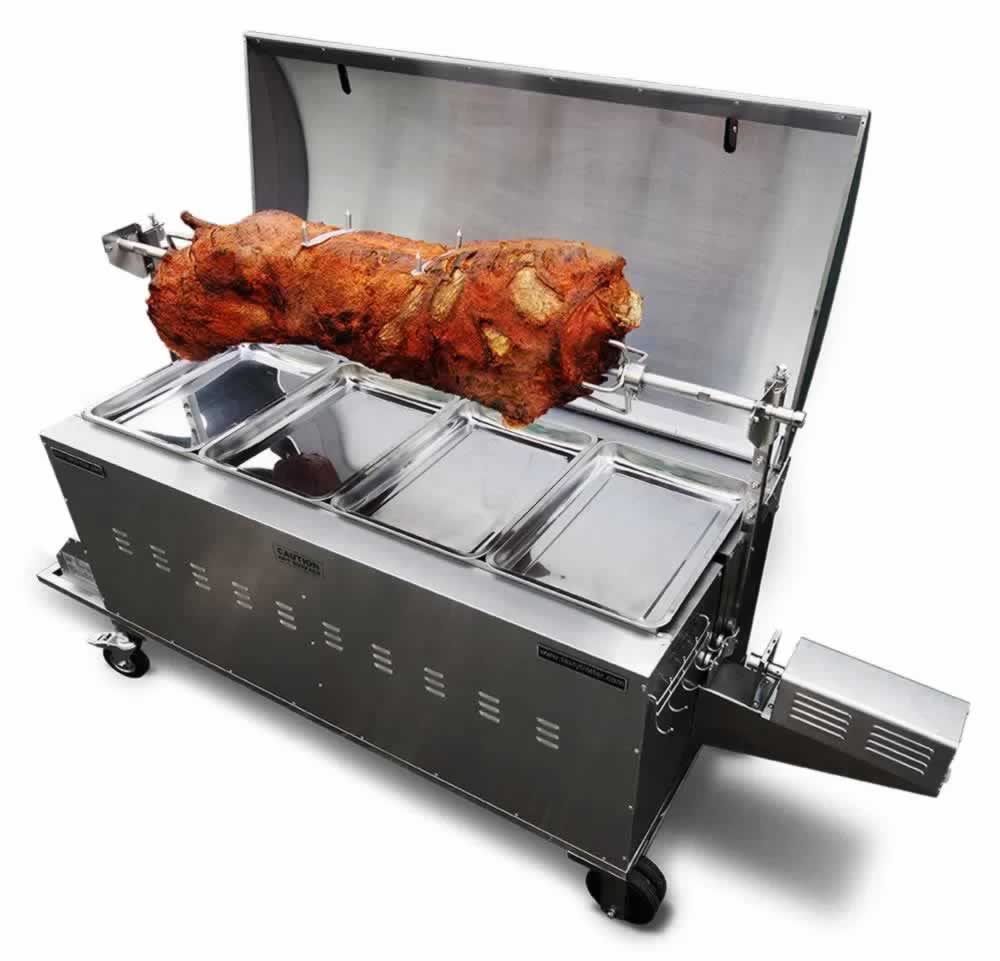A hog roaster cooking a whole pig outdoors.
